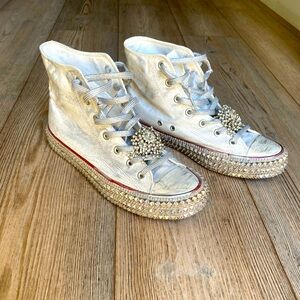 White and silver Nan-Ku high top tennis shoes